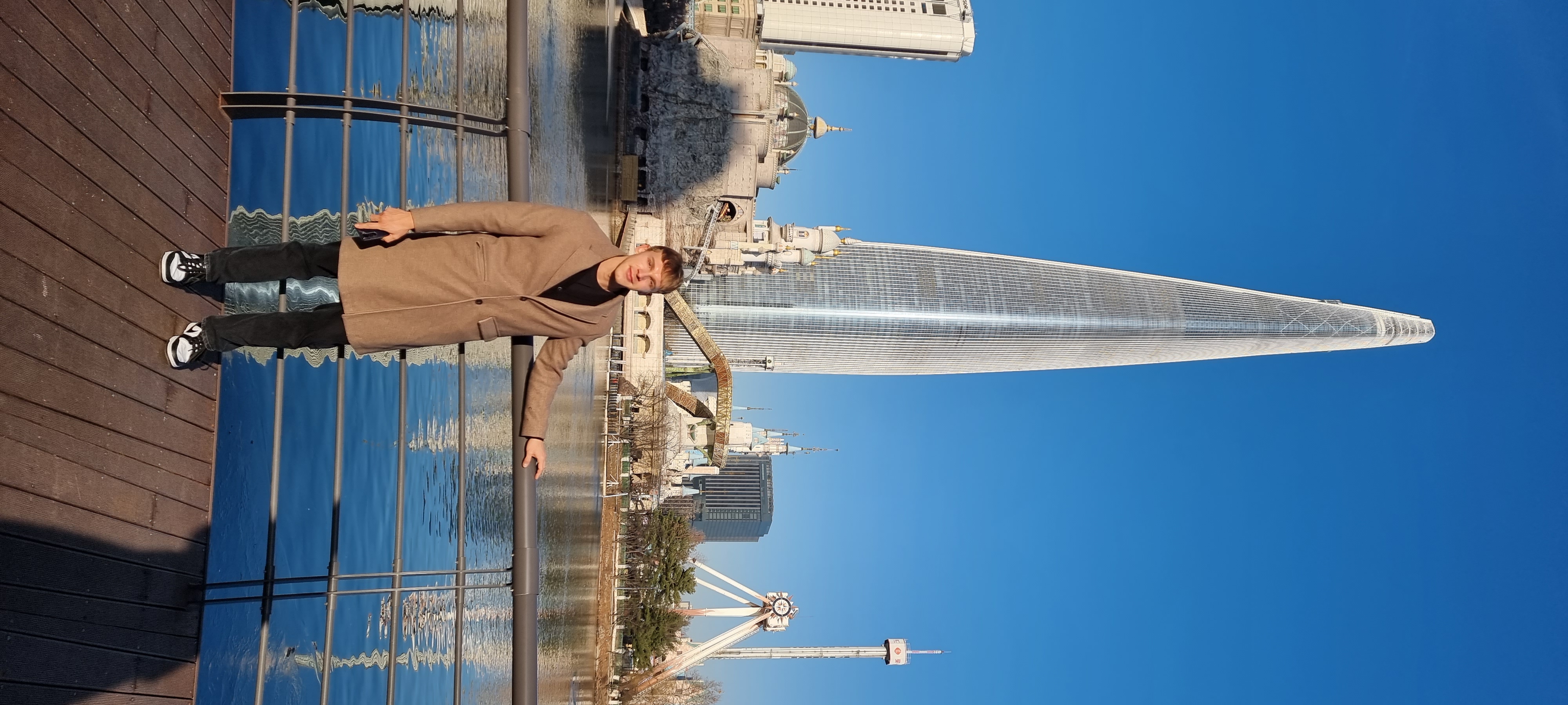 Aaron beside Seokchon Lake with Lotte World Tower behind him in Seoul